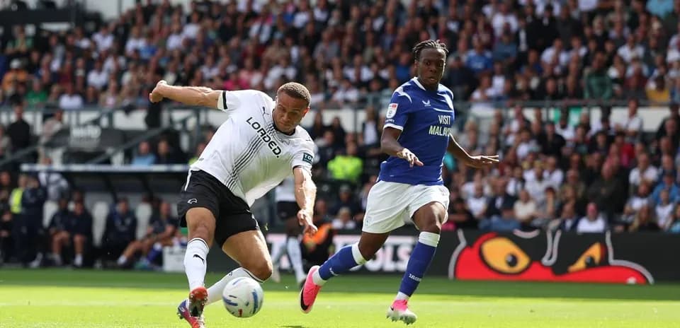 Player from Derby County kicking the ball during match