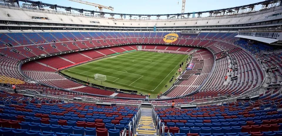 View of stadium seating and football pitch under construction