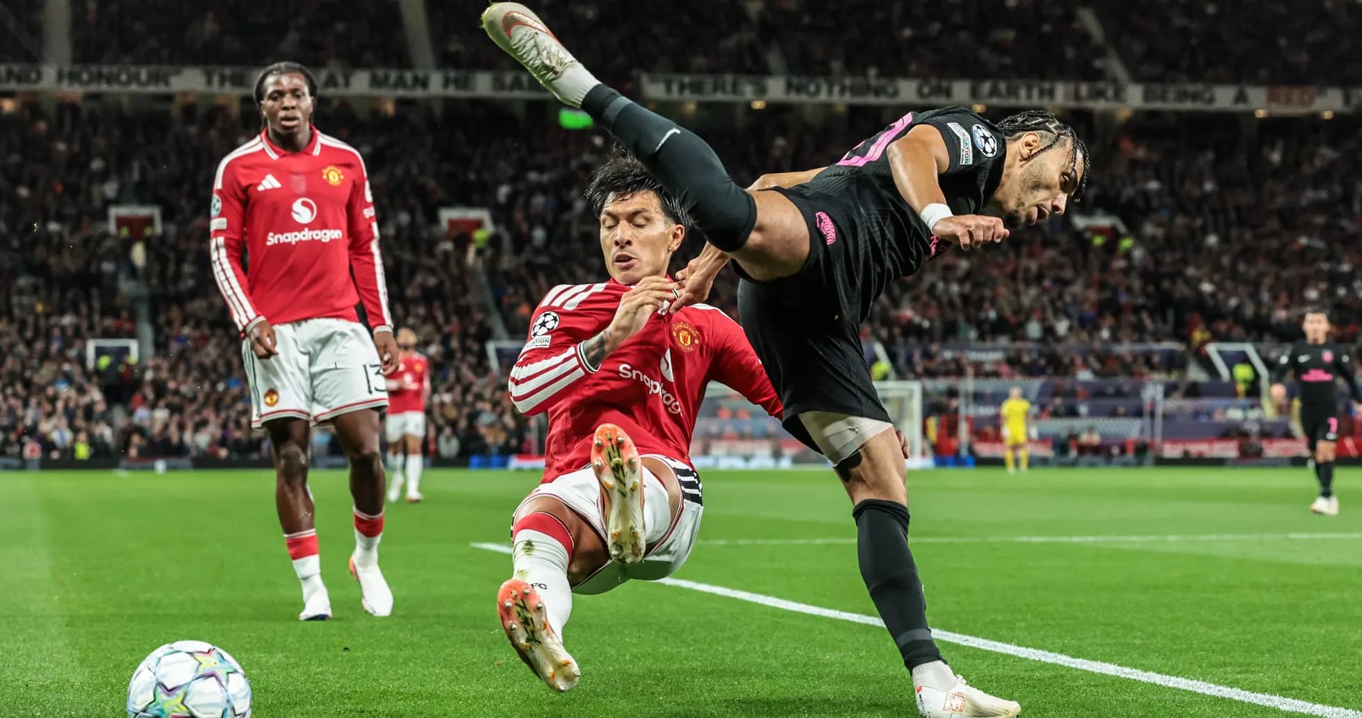 Player tackling opponent near corner flag during match