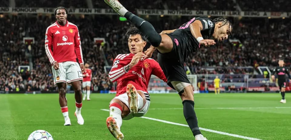 Player tackling opponent near corner flag during match