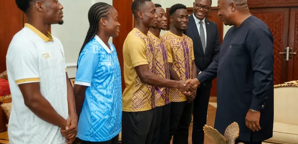 Athletes meeting with a dignitary in office