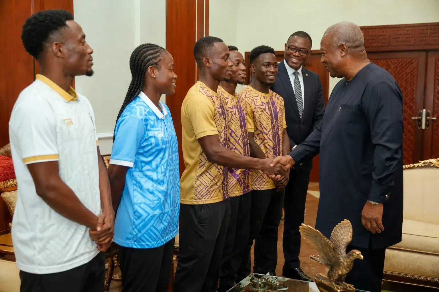 Athletes meeting with a dignitary in office