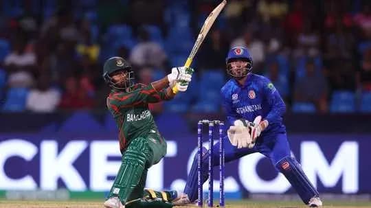 Bangladesh batsman hitting ball against Afghanistan bowler