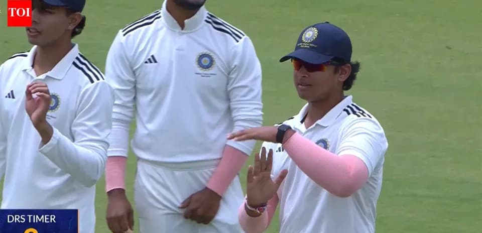 Cricket players discussing strategy during match