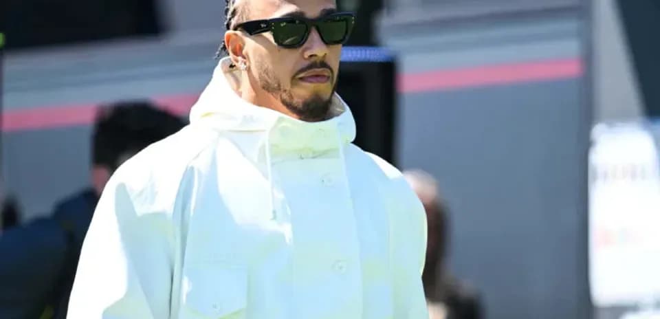 Lewis Hamilton arriving at the event in stylish outfit