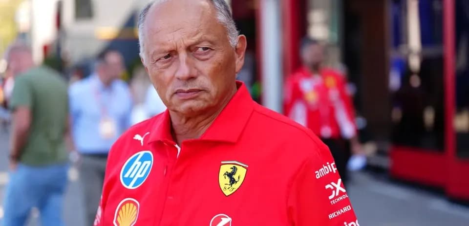 Team principal in Ferrari uniform at the paddock