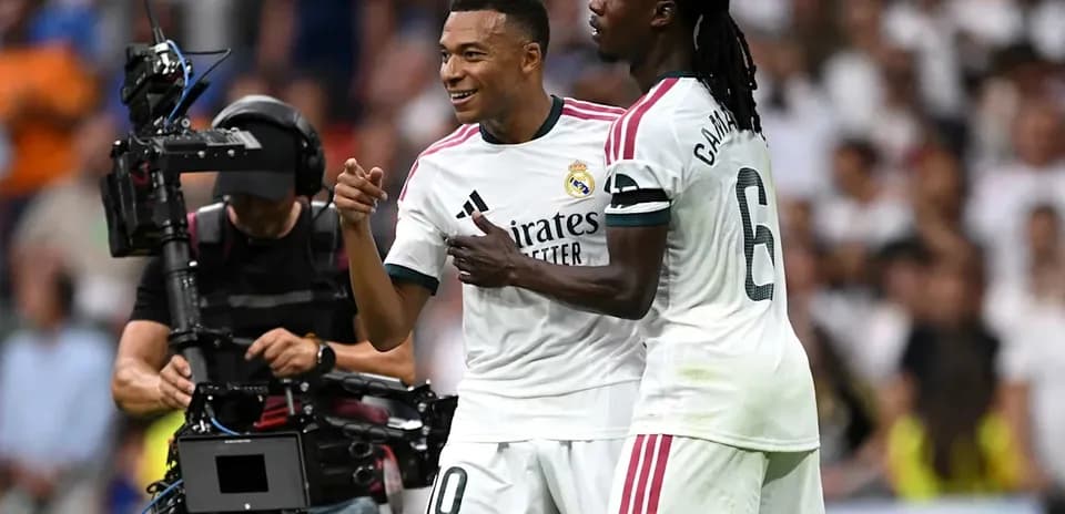 Kylian Mbappé celebrating with teammate Eduardo Camavinga
