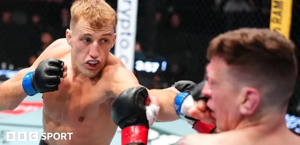 Fighter throwing a punch during MMA match