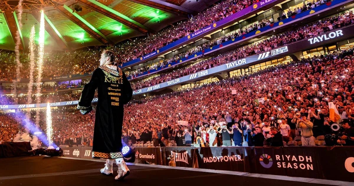 Boxer entering arena with fireworks and cheering crowd