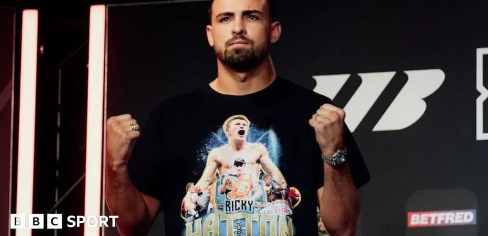 Boxer posing with fists raised at event