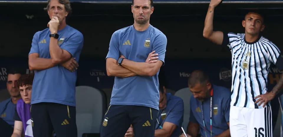 Coaches observing match from the bench area