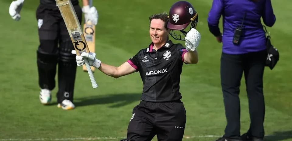 Batter celebrating after scoring a half-century