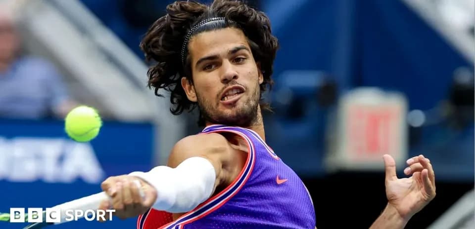 Player hitting a tennis ball during a match
