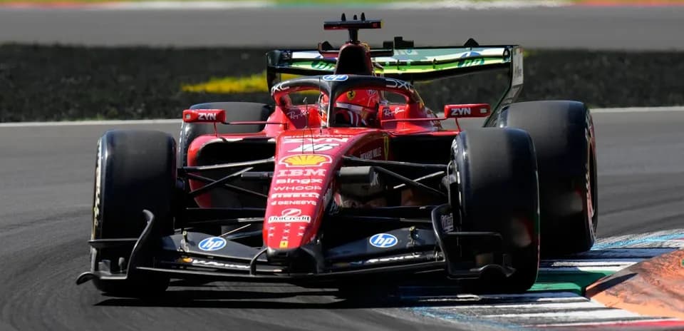 Ferrari racing car navigating a track corner
