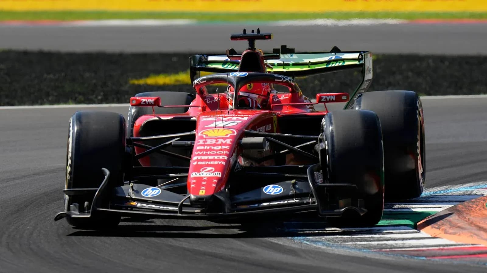 Ferrari racing car navigating a track corner