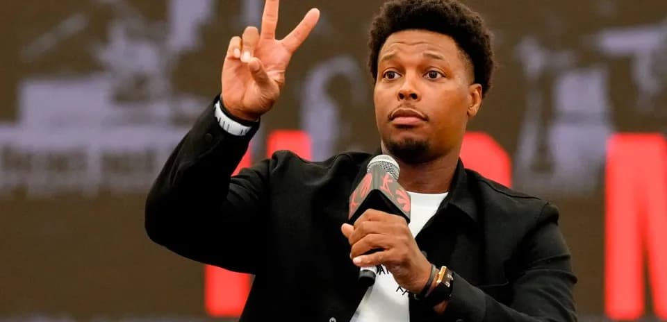 Player gesturing during press conference with microphone
