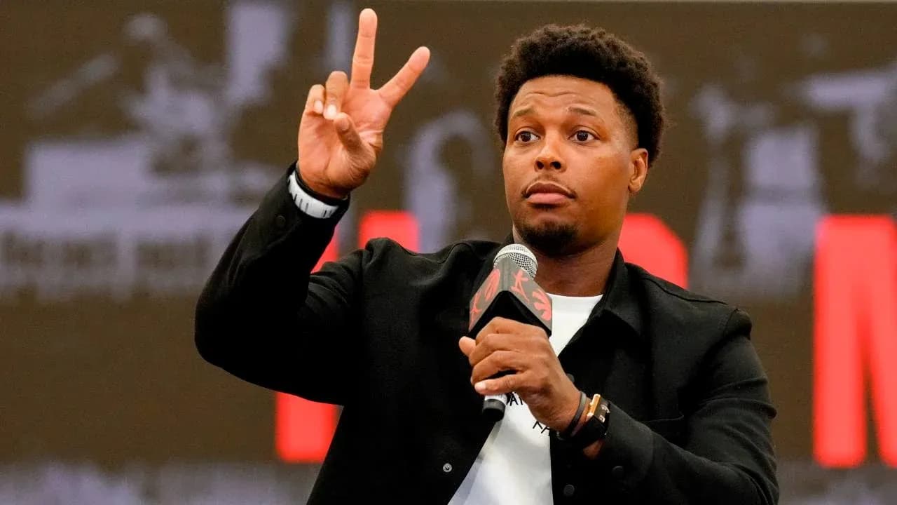 Player gesturing during press conference with microphone