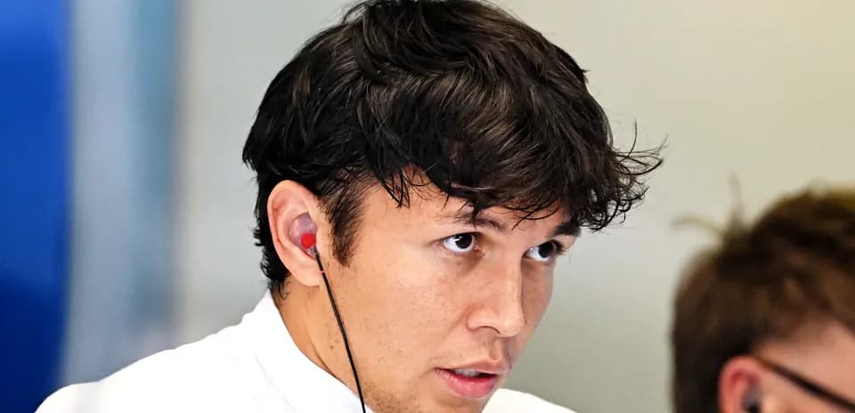Driver wearing earbuds, focused on the task ahead