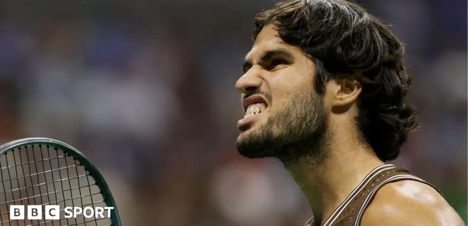 Tennis player celebrating with racket on court