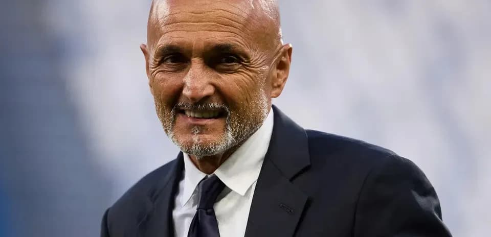 Coach smiling before the match in formal attire