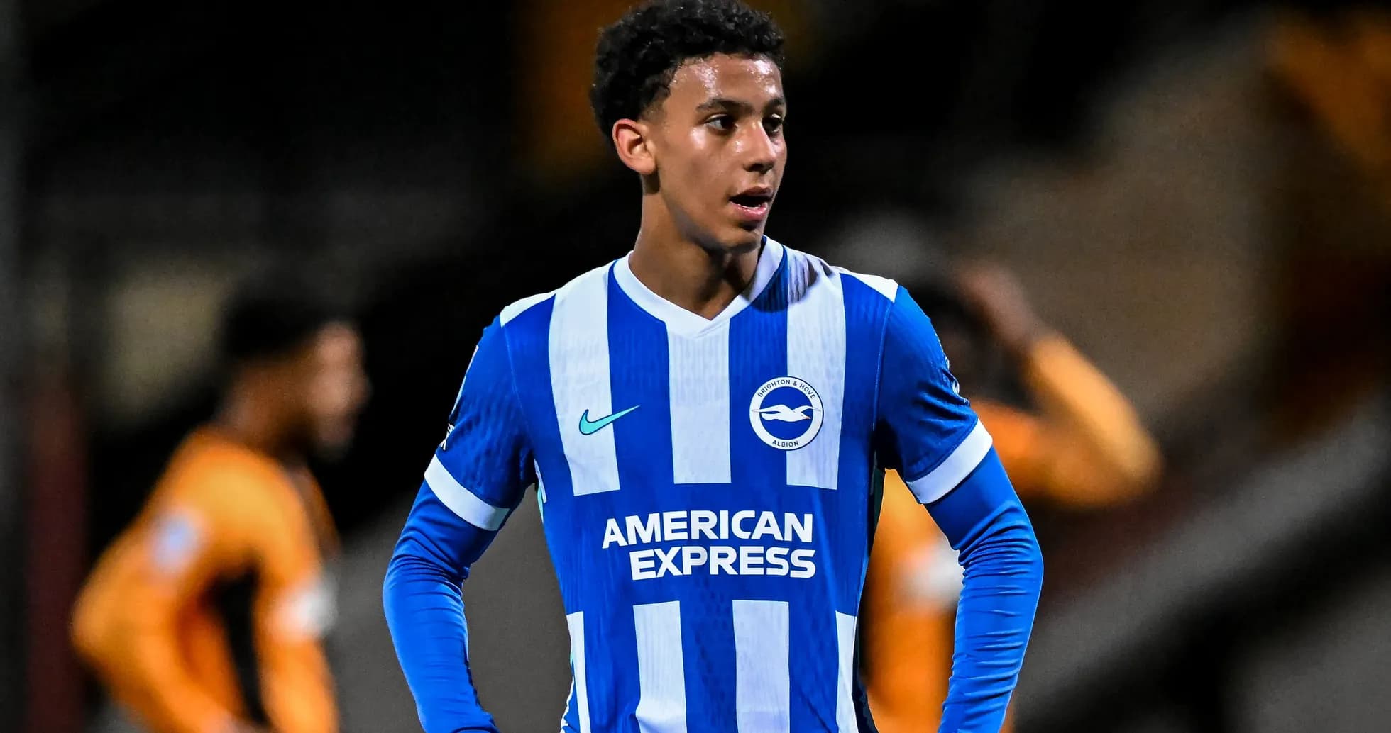 Brighton player in blue and white kit during match