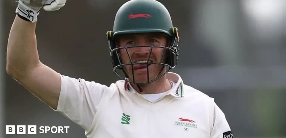 Cricketer celebrating a run during a match
