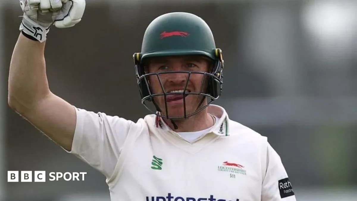Cricketer celebrating a run during a match
