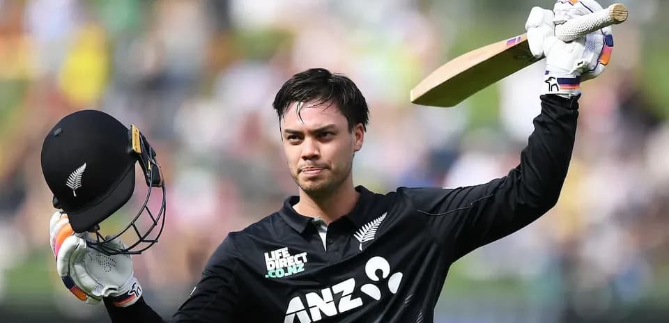 Cricketer celebrating a century with helmet and bat