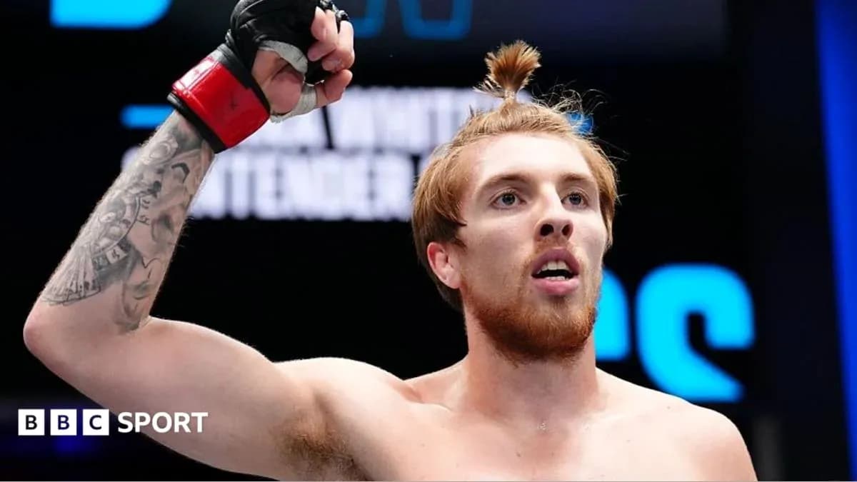 Fighter celebrating victory in the ring