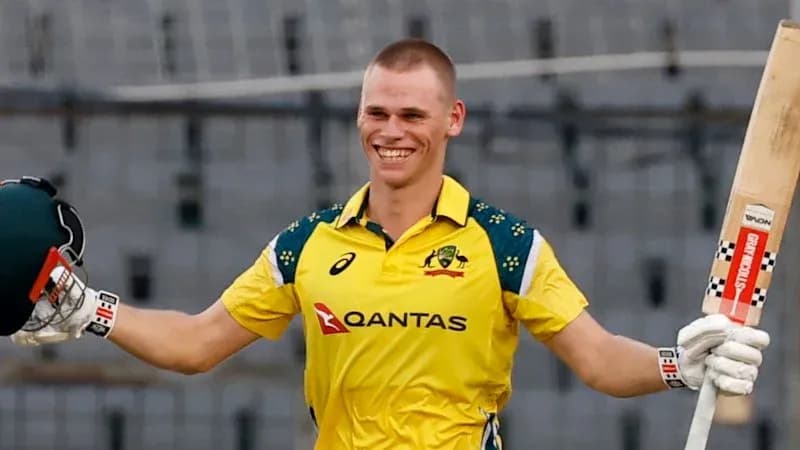 Cricketer celebrating a milestone with bat raised
