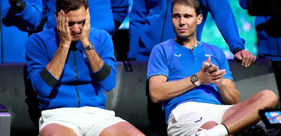 Roger Federer and Rafael Nadal sitting together, emotional