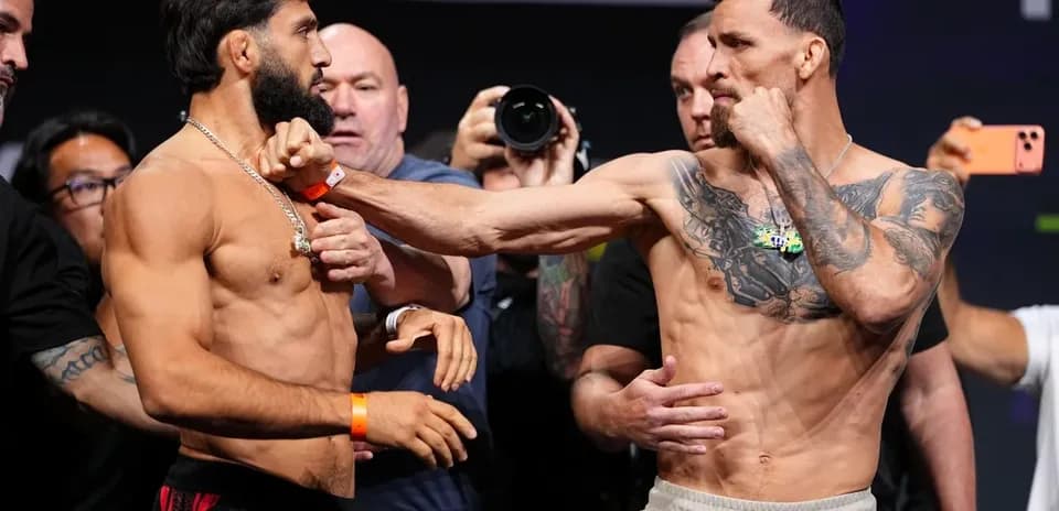 Two fighters facing off at weigh-in event