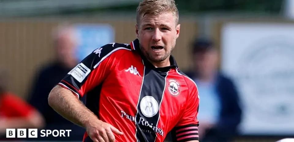 Player in red jersey during a football match