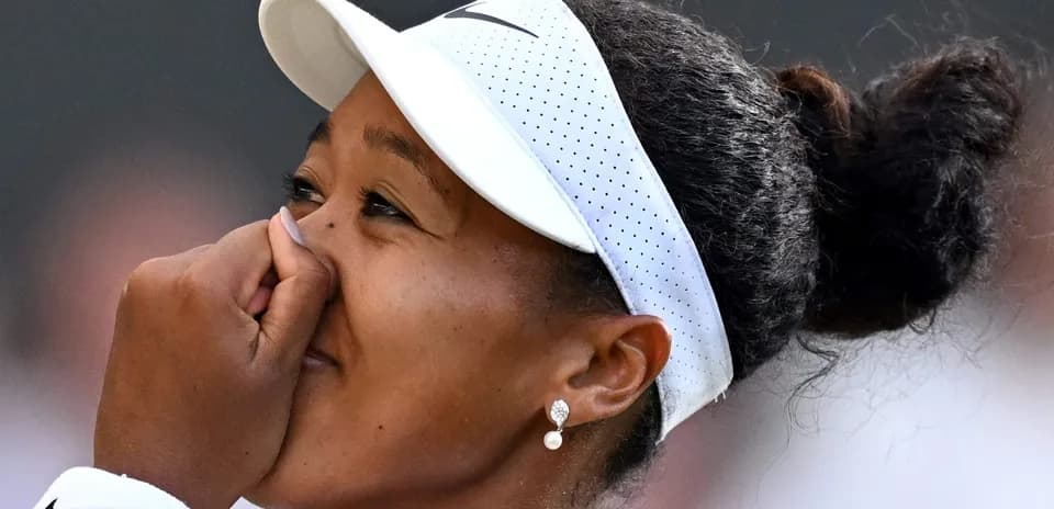 Naomi Osaka celebrating after winning a match