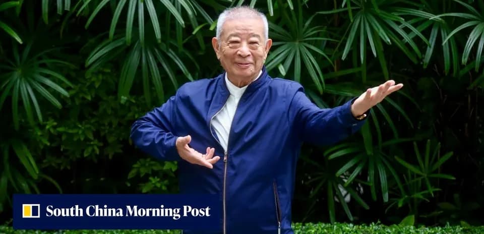 Elderly man performing tai chi in garden