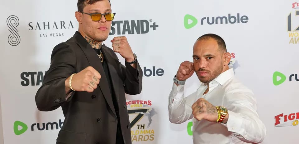 Two fighters posing at MMA awards event