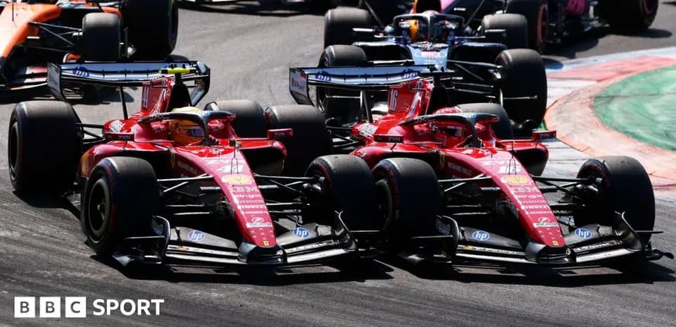 Two Ferrari cars racing closely during a Formula 1 event