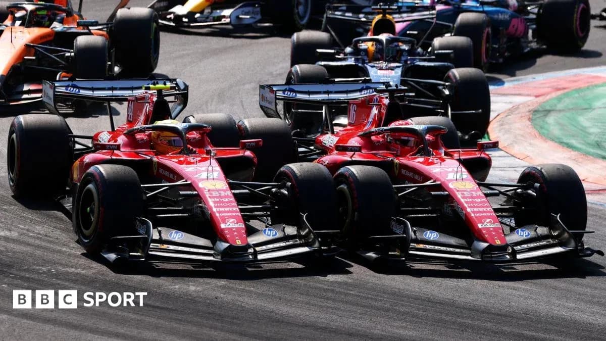 Two Ferrari cars racing closely during a Formula 1 event