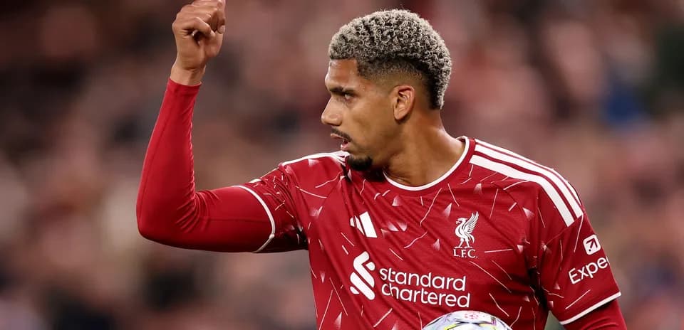 Player signaling during match in Liverpool kit