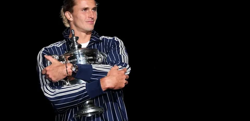 Player holding a trophy on stage