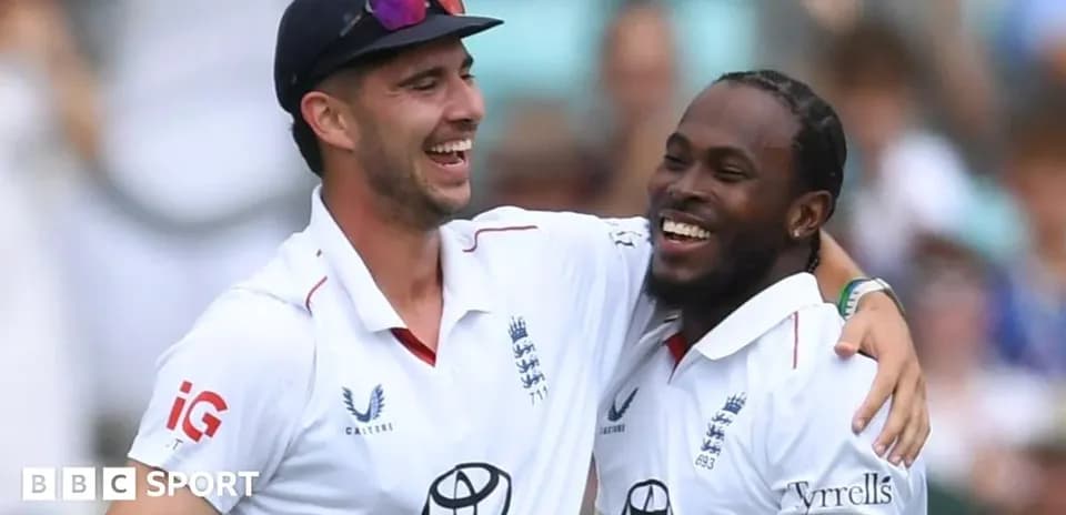 Two England cricketers celebrating on the field