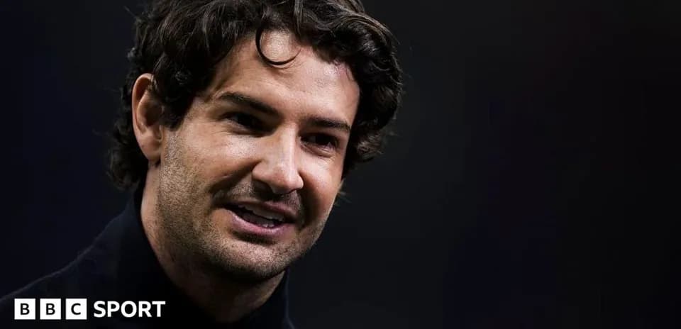 Smiling man speaking during a press event