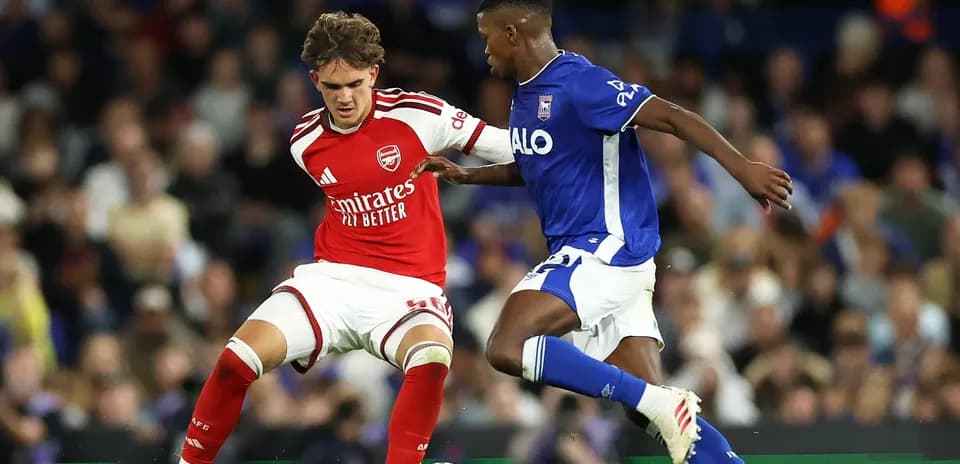 Two players battling for possession during match