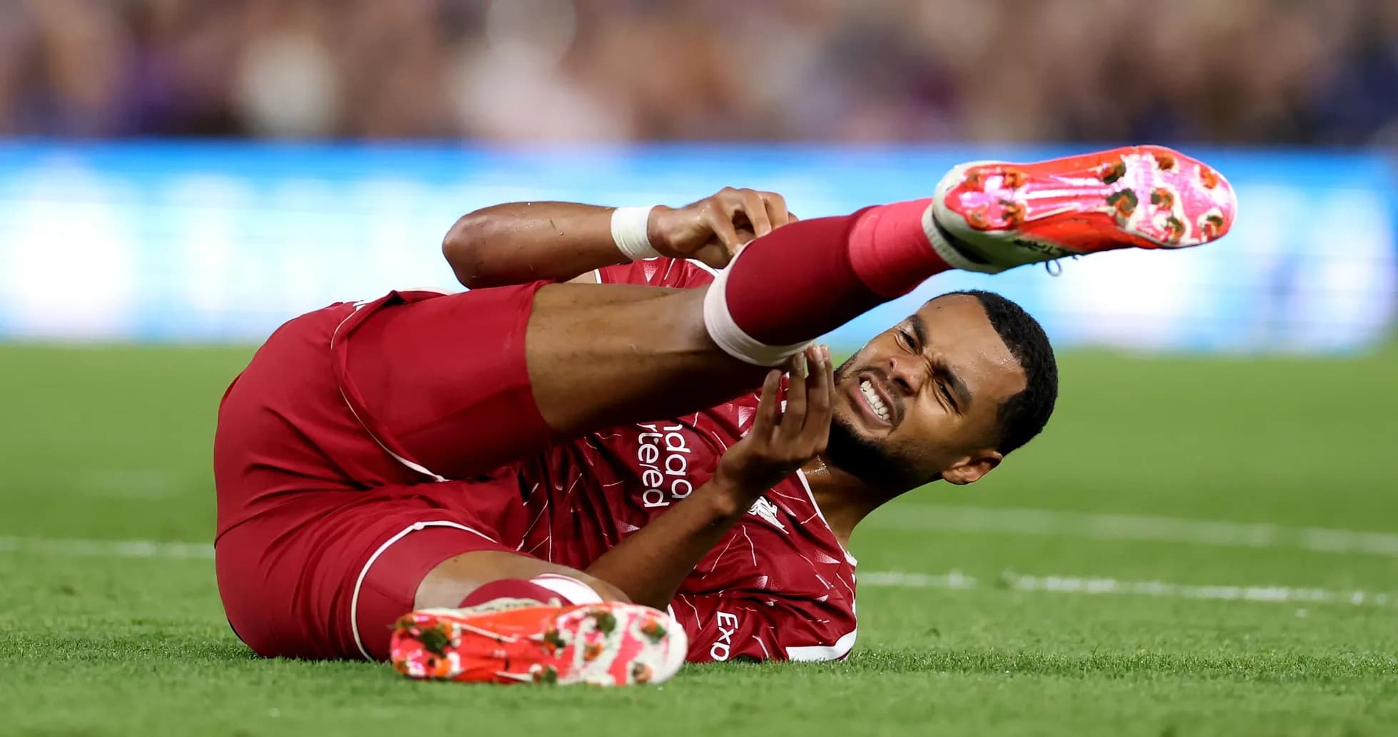 Player on the ground holding injured leg