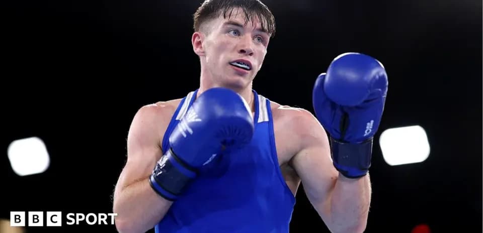 Boxer in blue gloves preparing for a match