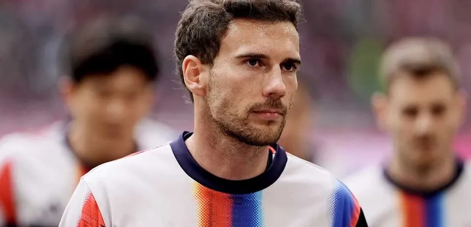 Player walking onto the field before the match