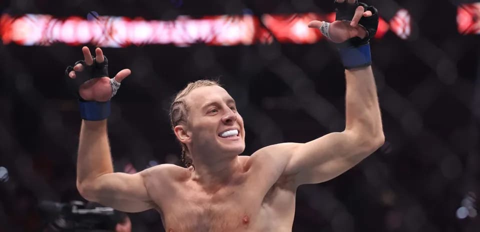 Fighter celebrating victory inside the octagon