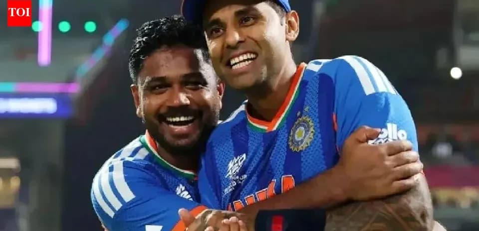 Two cricketers celebrating together on the field