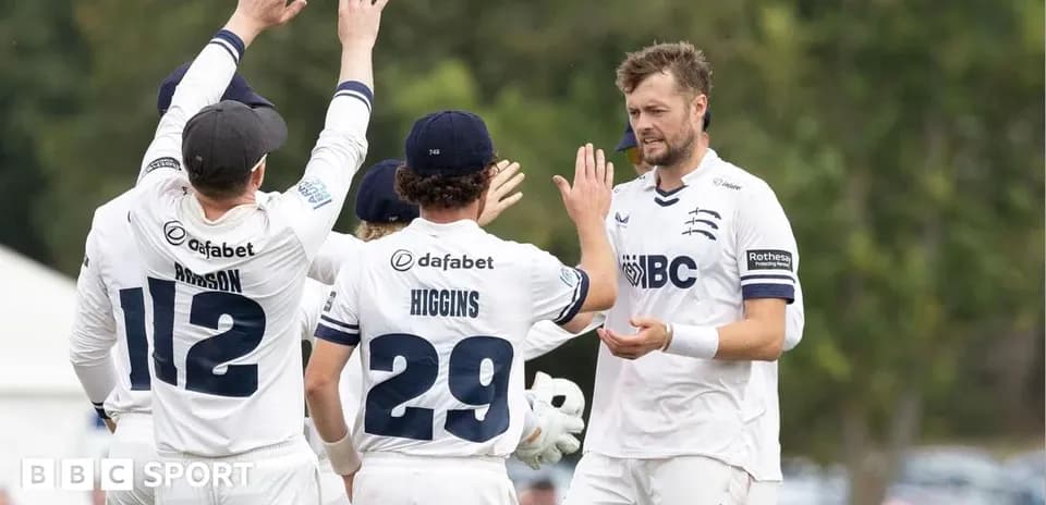 Cricket team celebrating a wicket during match