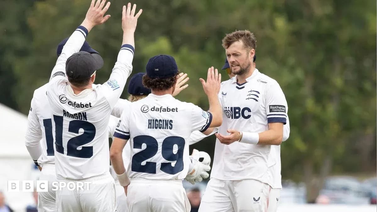 Cricket team celebrating a wicket during match